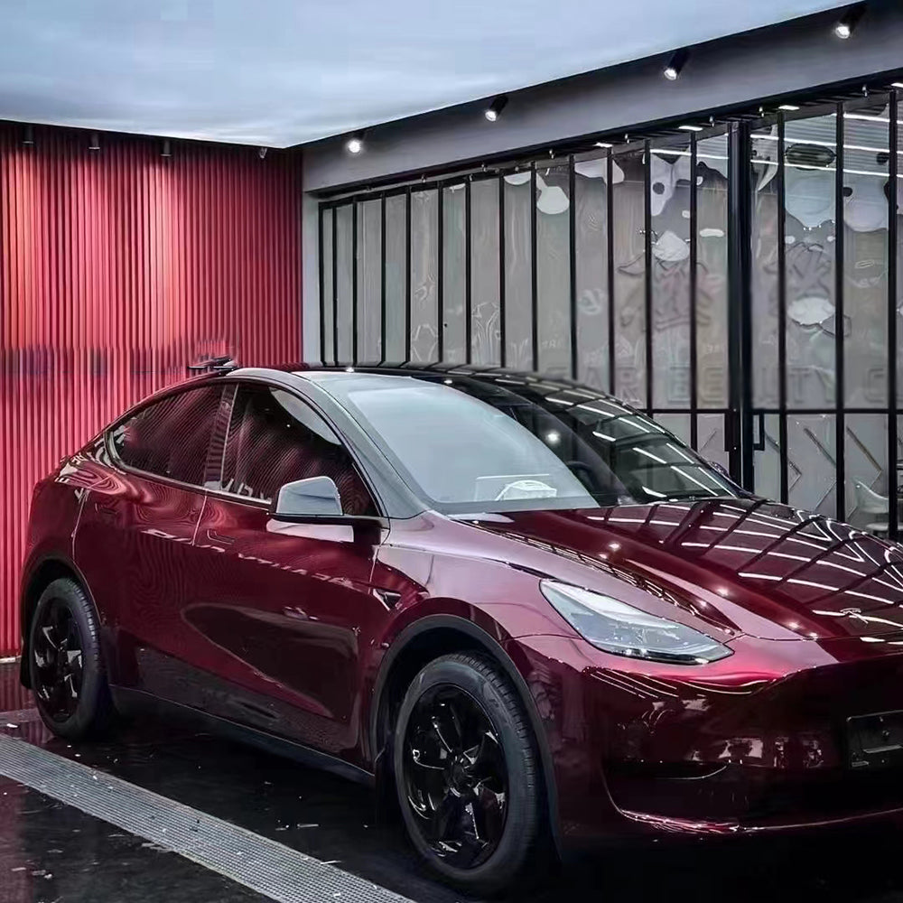 liquid dragon red car wrap on a tesla