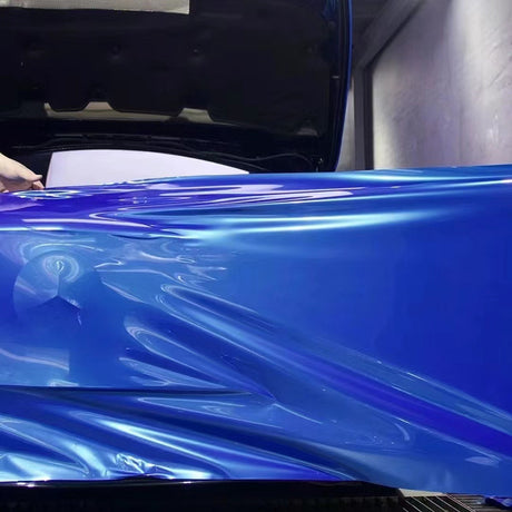 liquid olympic blue car wrap being installed