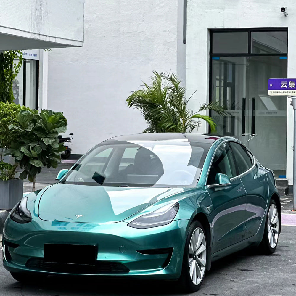 liquid peacock green car wrap on a car