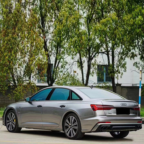 sedan wrapped in liquid silver car wrap