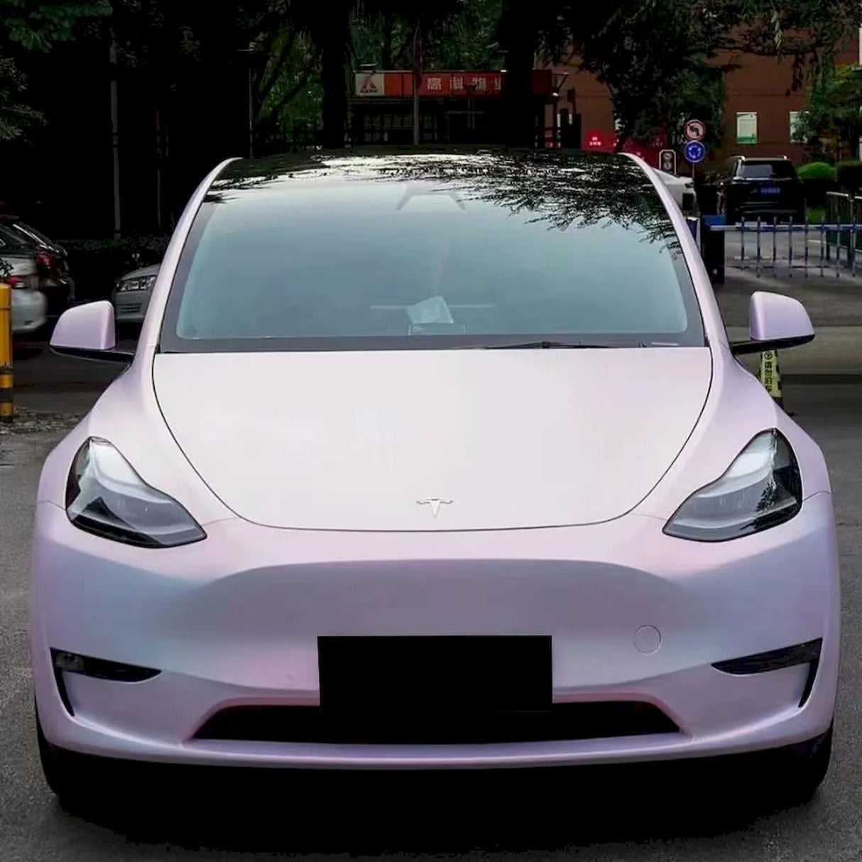 matte diamond pollen pink car wrap installed on a car