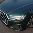 matte emerald green car wrap slight reflection during the dawn