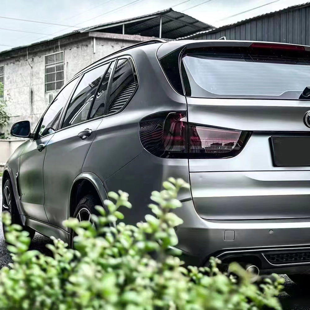 rear of an suv displaying matte liquid silver car wrap