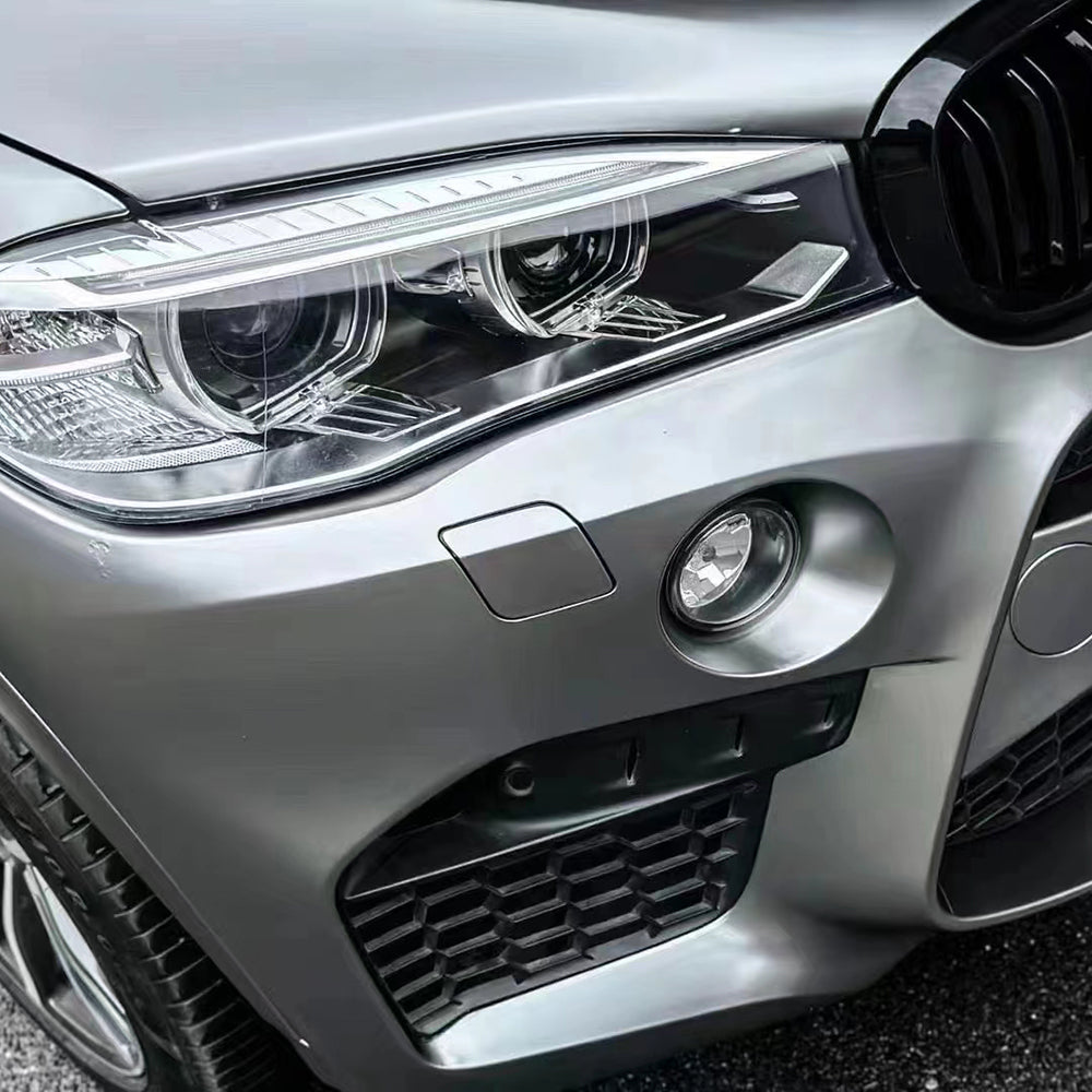 front bumper of an suv wrapped in matte liquid silver car wrap