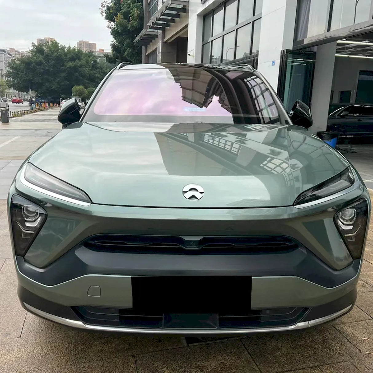 car wrapped with metallic aurora green car vinyl wrap