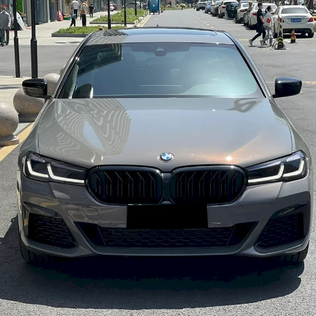 metallic bernina gray car wrap look during a sunny day