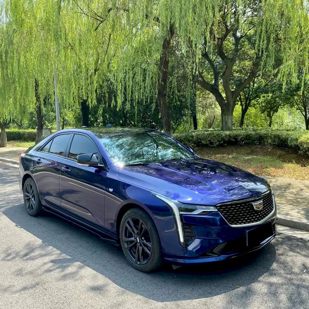 car wrapped in metallic gentian blue car wrap
