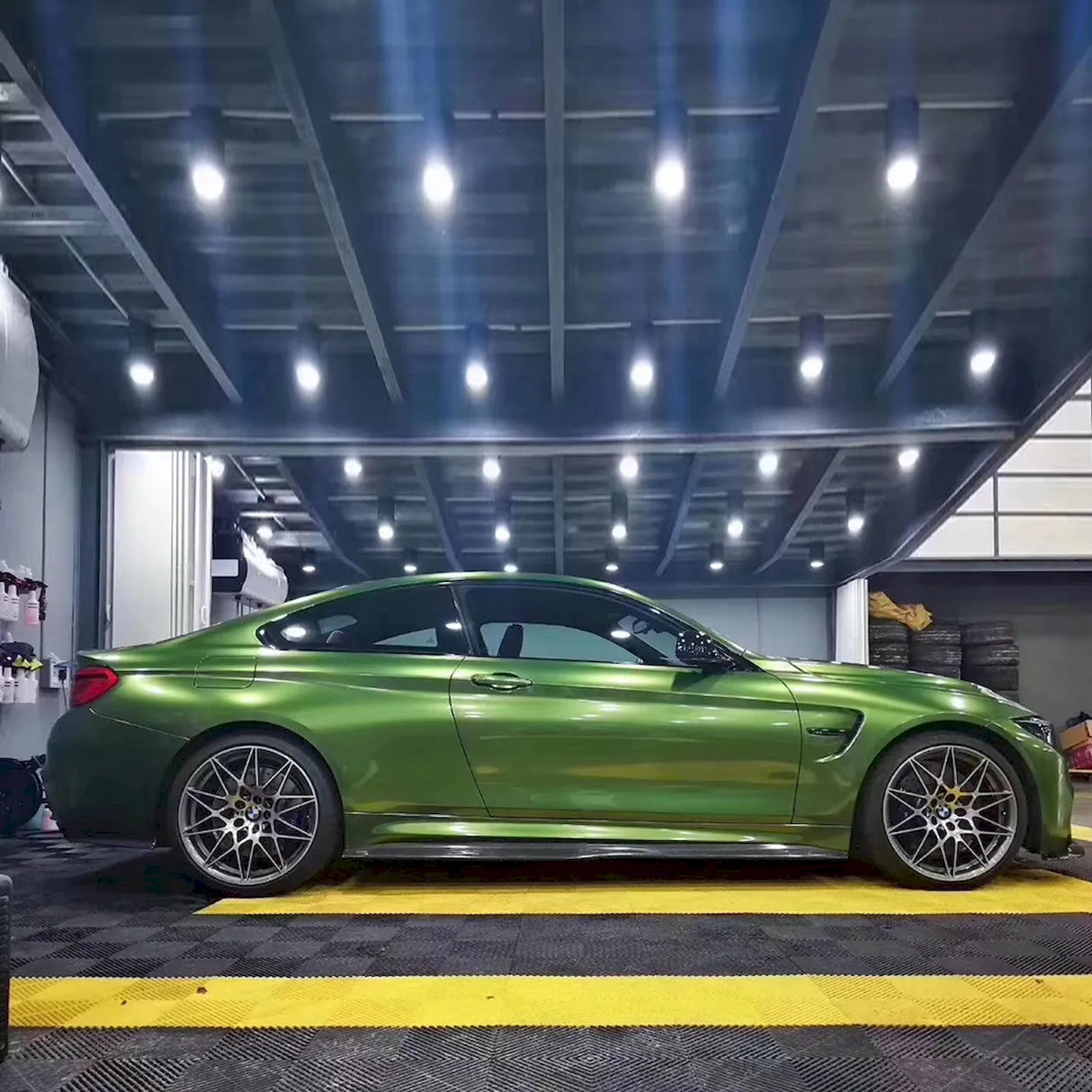 metallic mamba green car wrap installed on a coupe