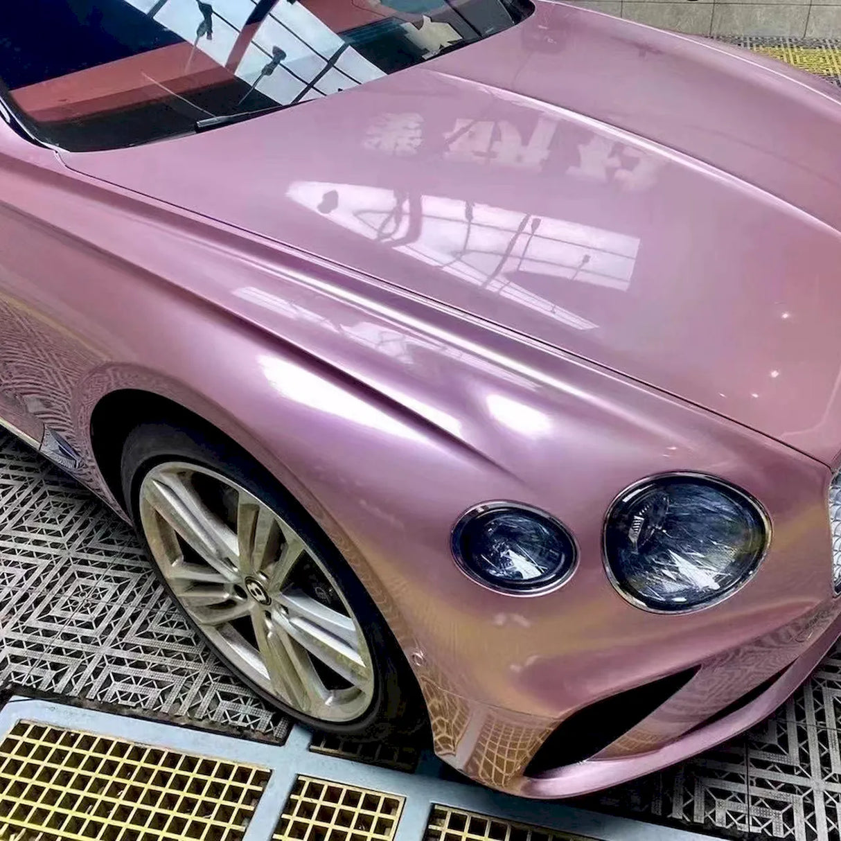 metallic passion pink wrap on a luxury car