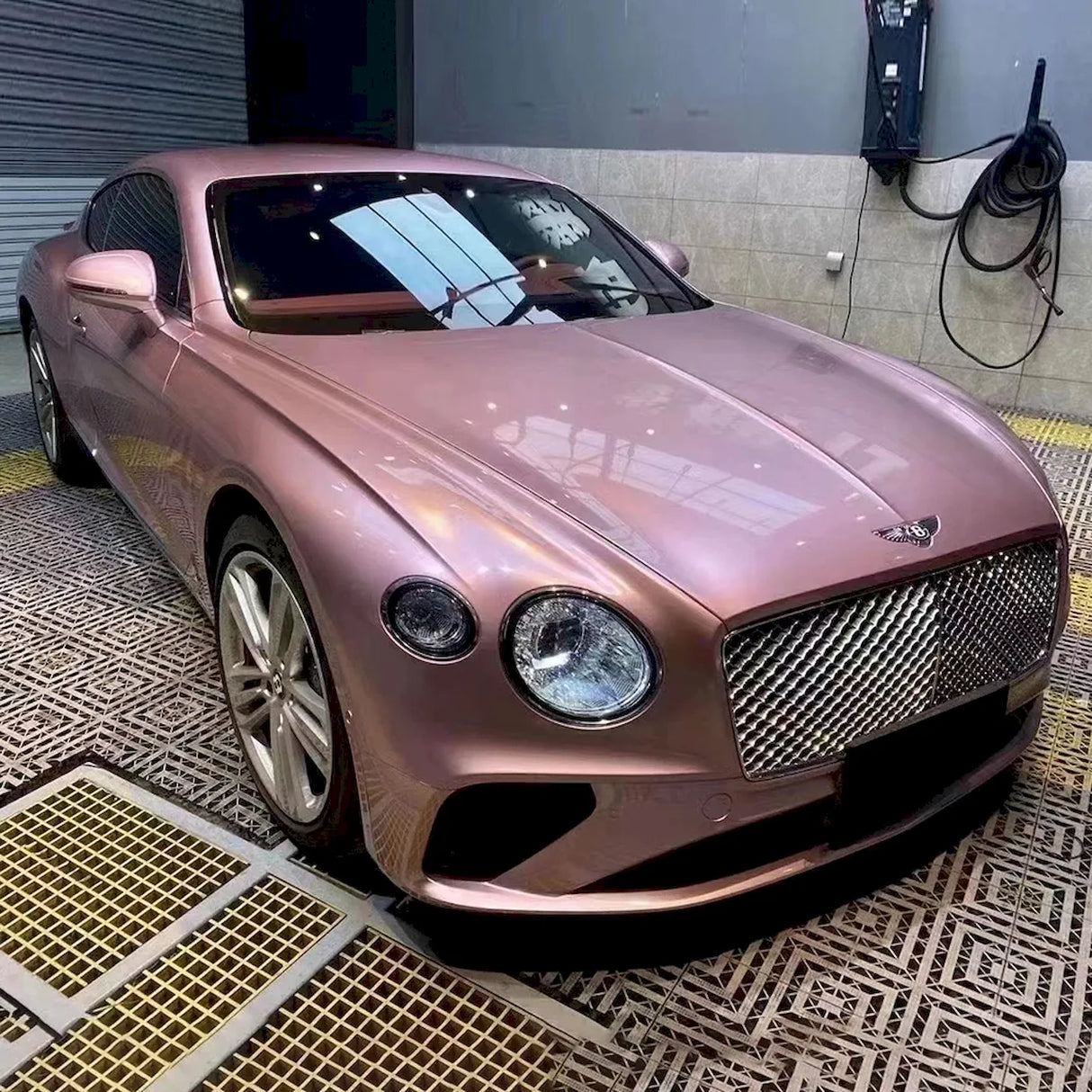 sports coupe wrapped in metallic passion pink wrap