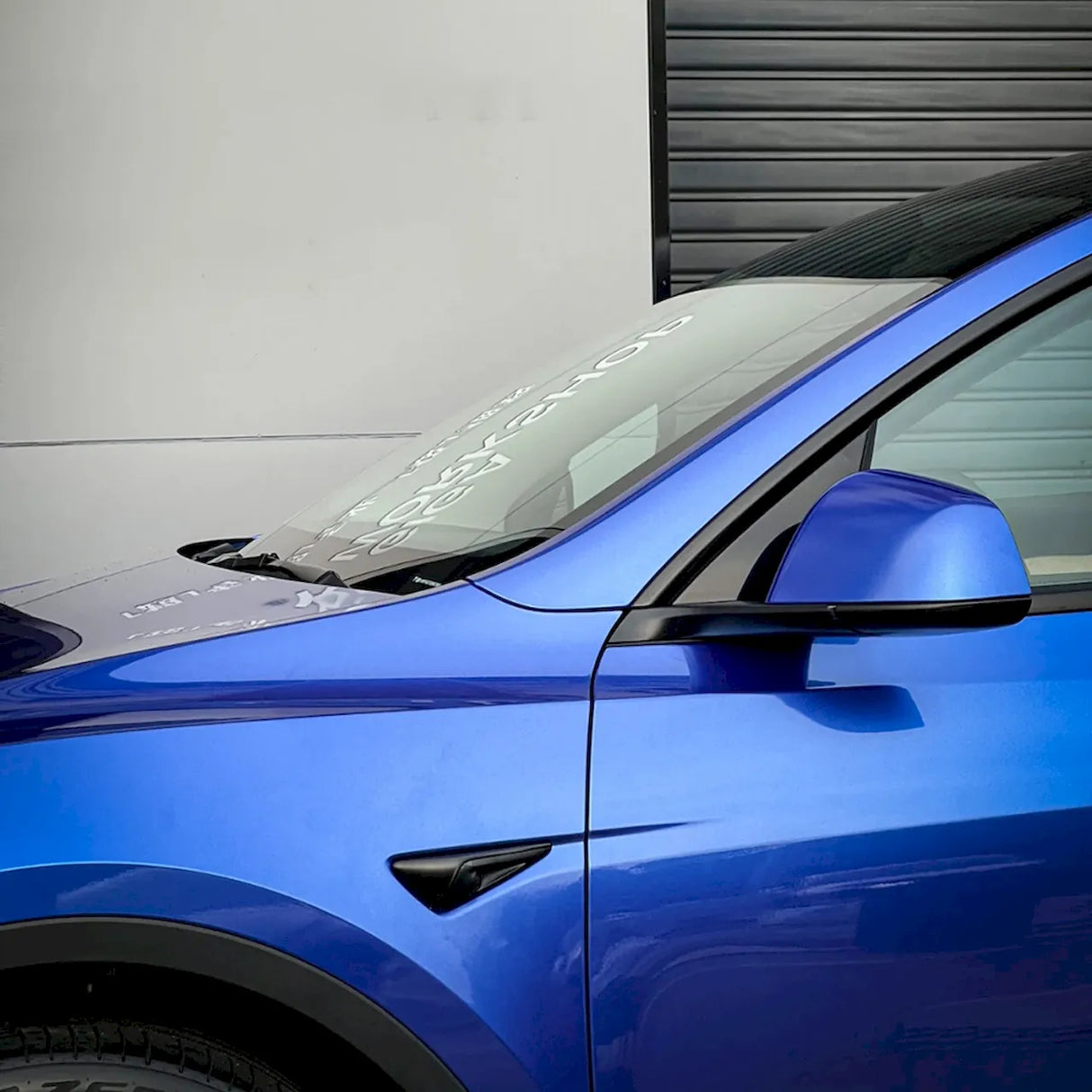 car wrapped in portimand blue vinyl wrap