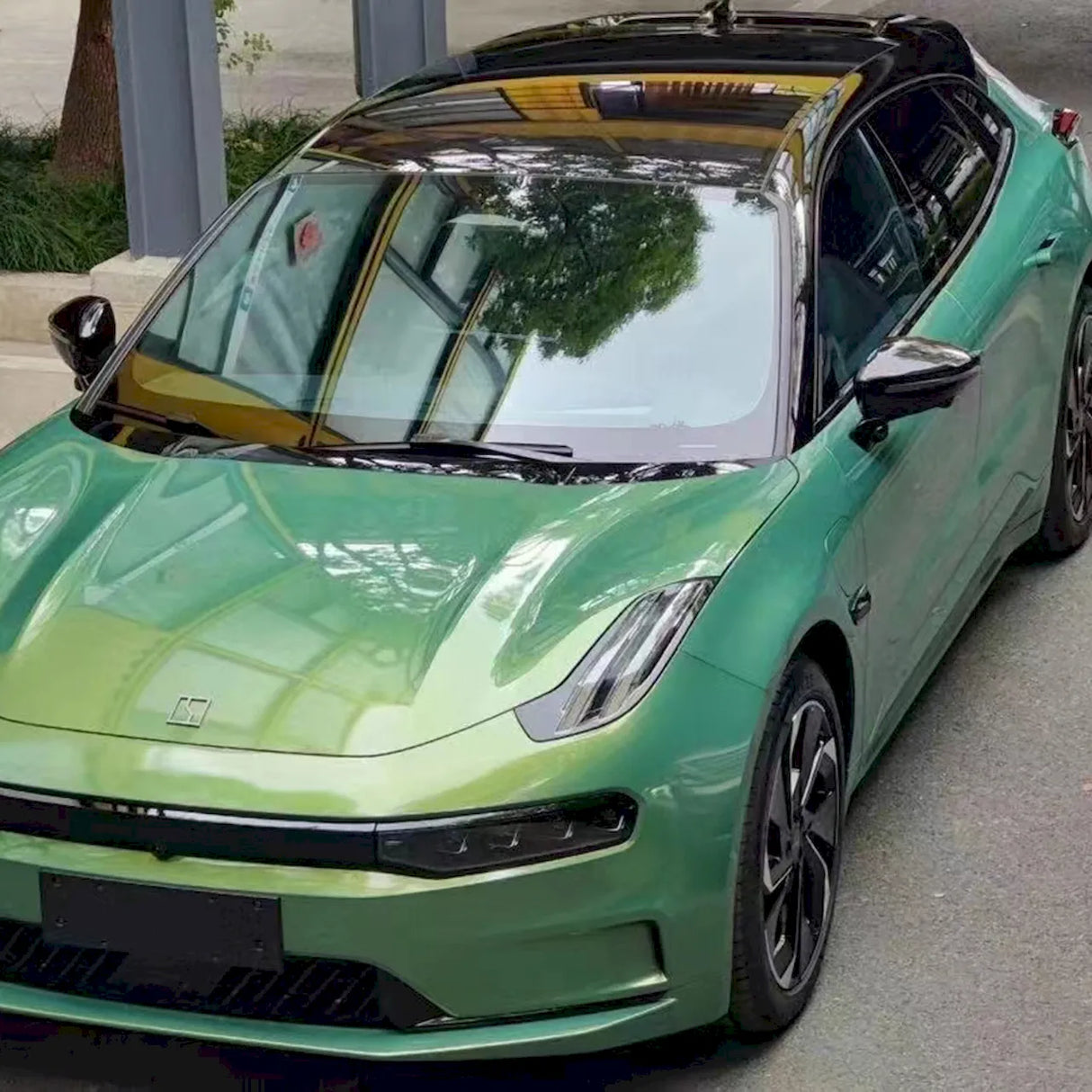 car wrapped in metallic rainbow green vinyl wrap