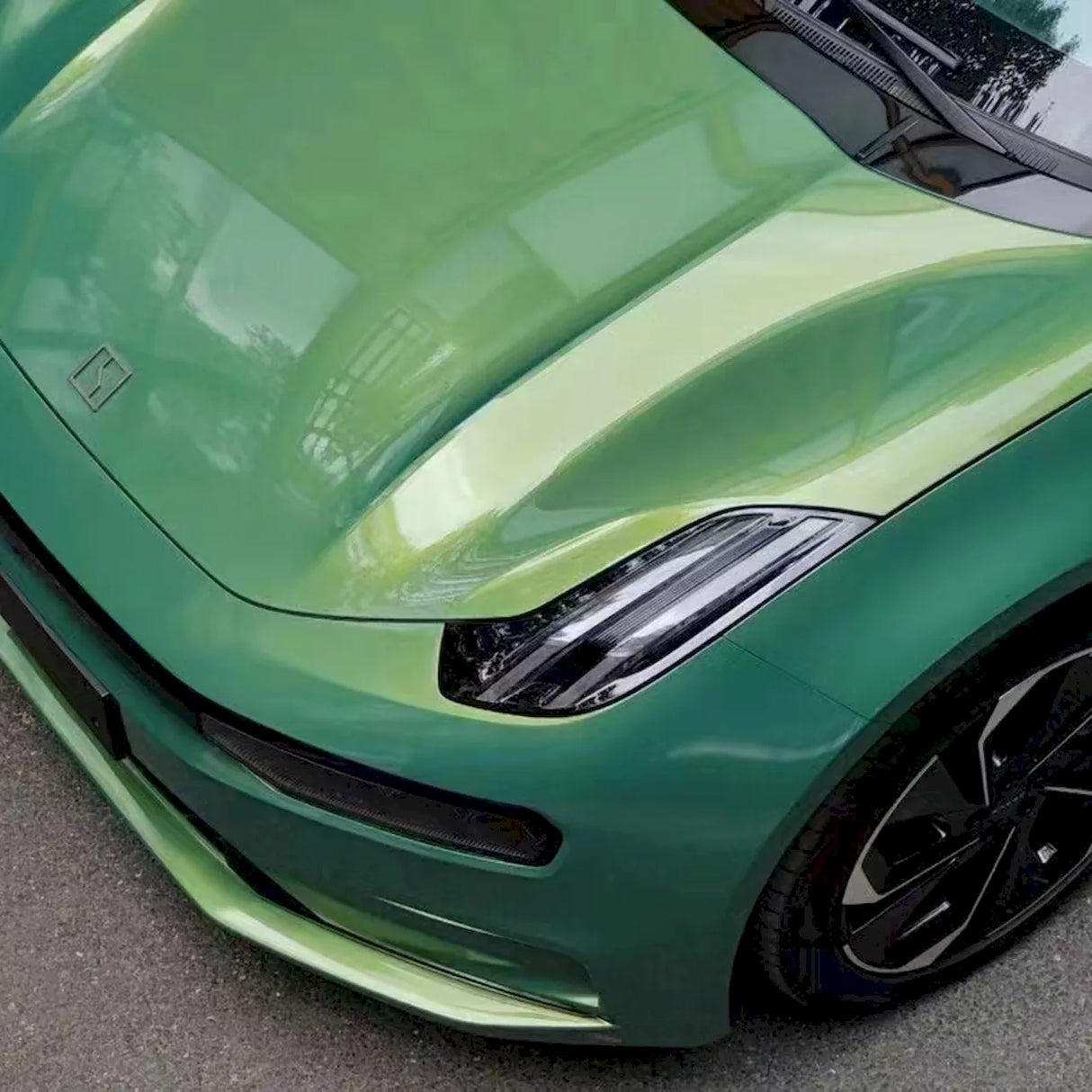 metallic rainbow green car wrap up close view