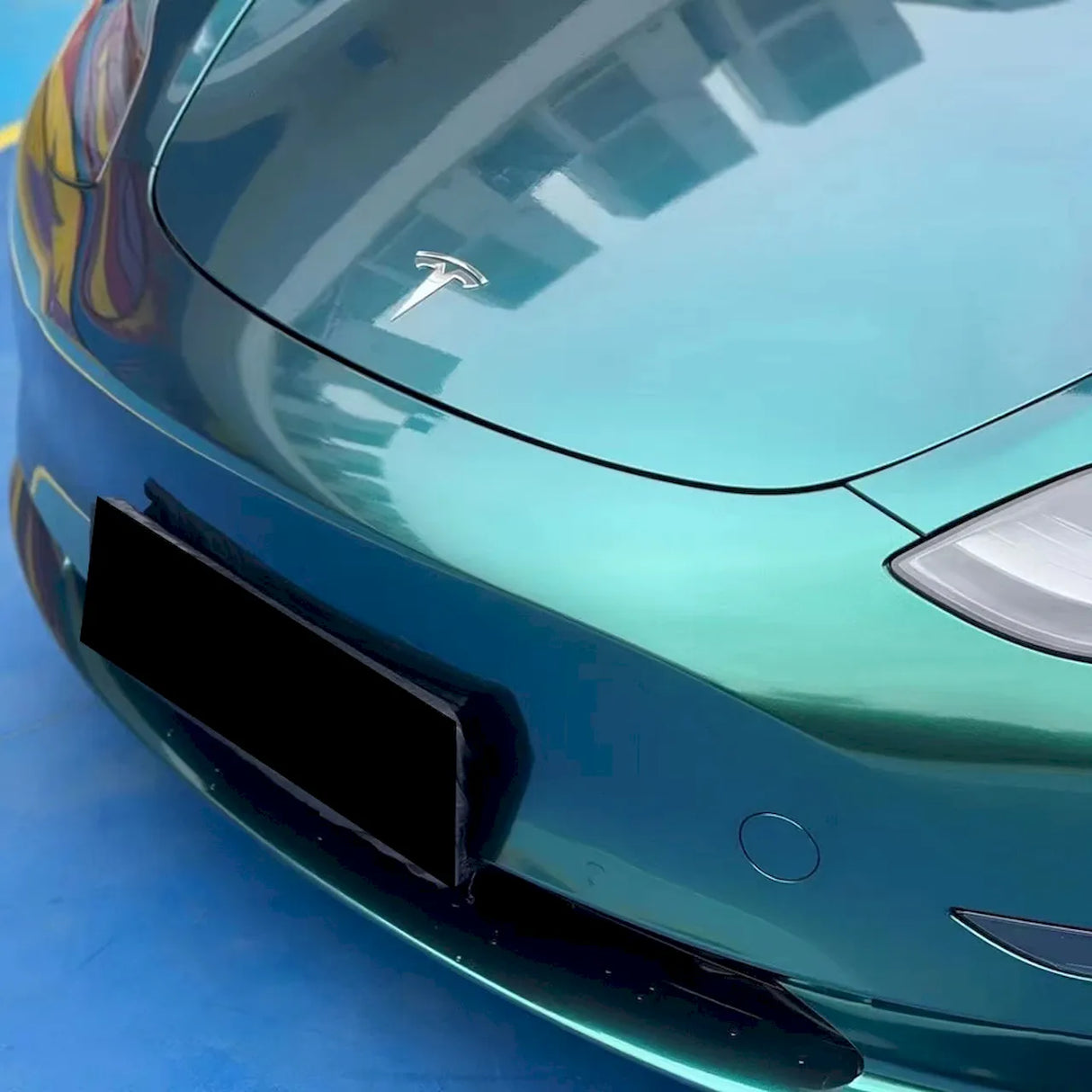 metallic royal green car wrap installed on a car