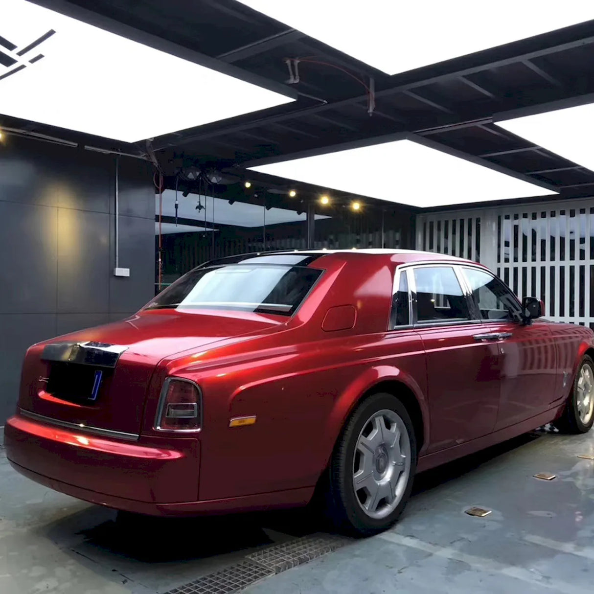 large vehicle wrapped in metallic soul red car vinyl wrap