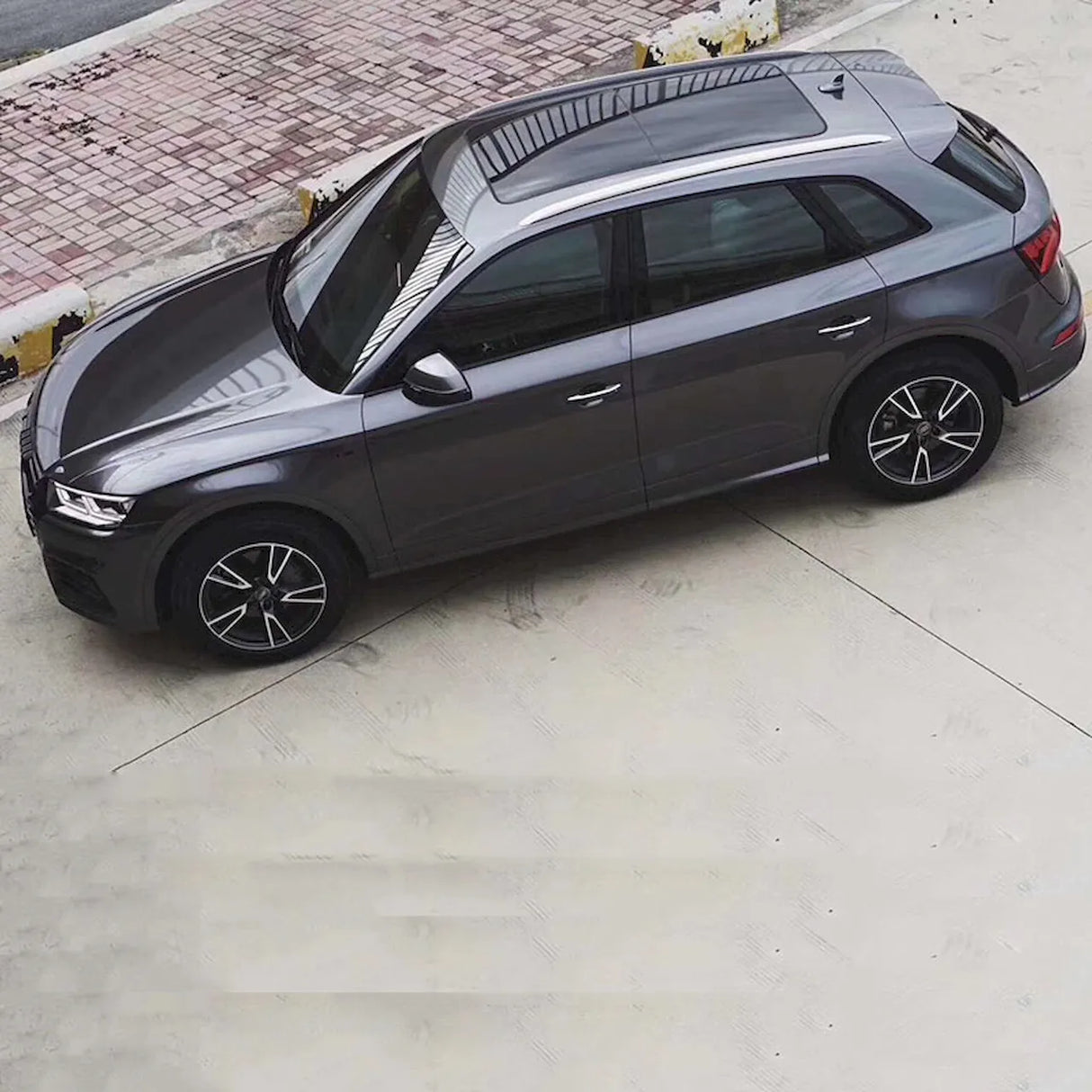 space gray gloss car wrap installed on a suv