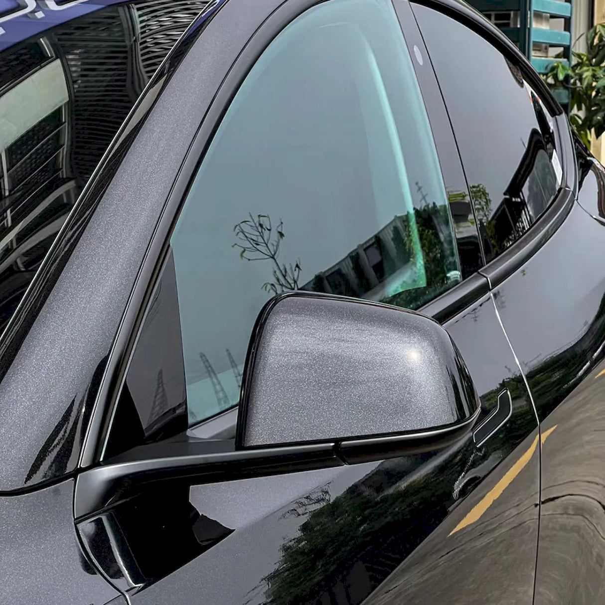 metallic sparkling black car wrap upclose shot