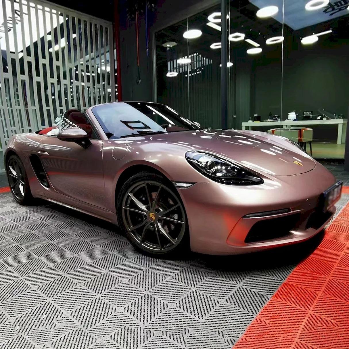 porsche boxter wrapped in metallic strawberry pink vinyl wrap