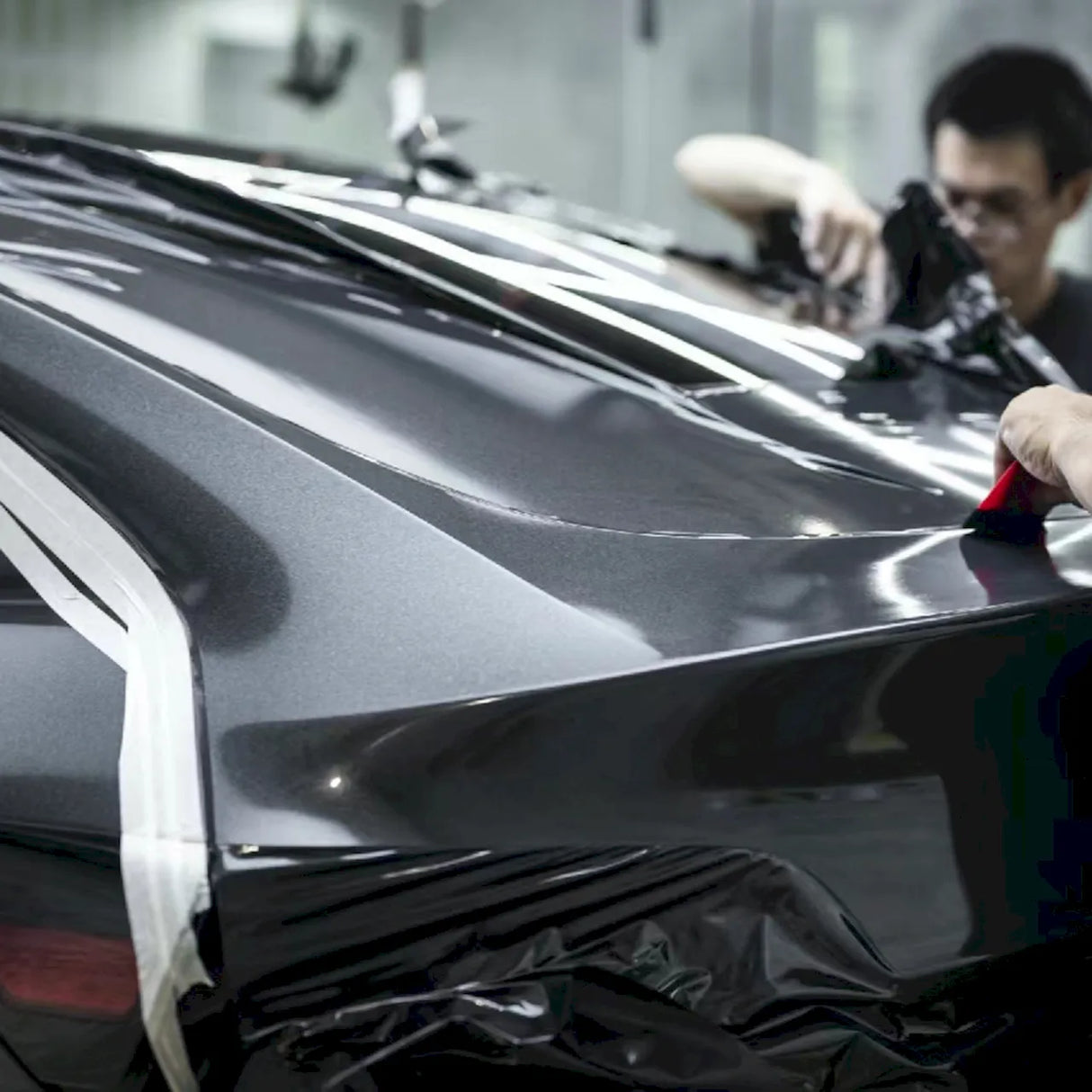metallic volcano gray vinyl wrap being installed