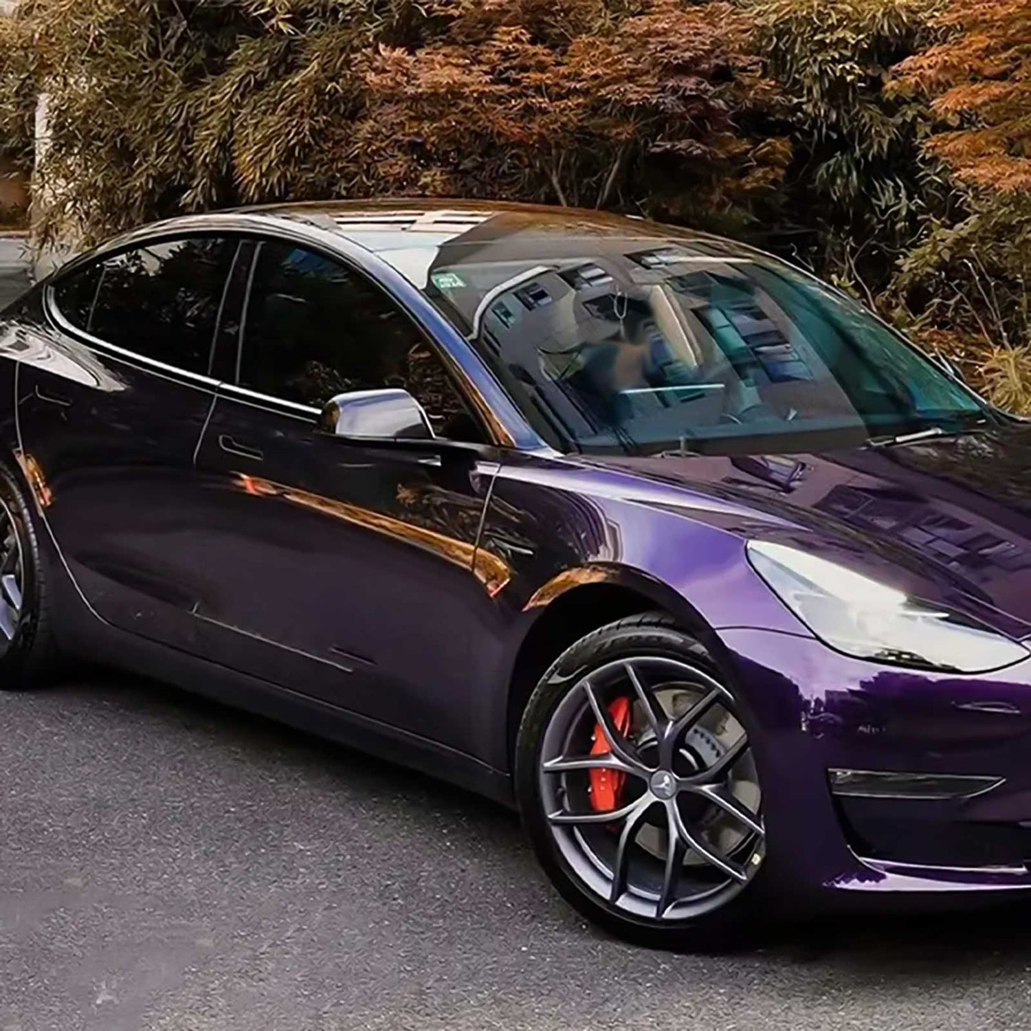 tesla wrapped in venetian purple car wrap