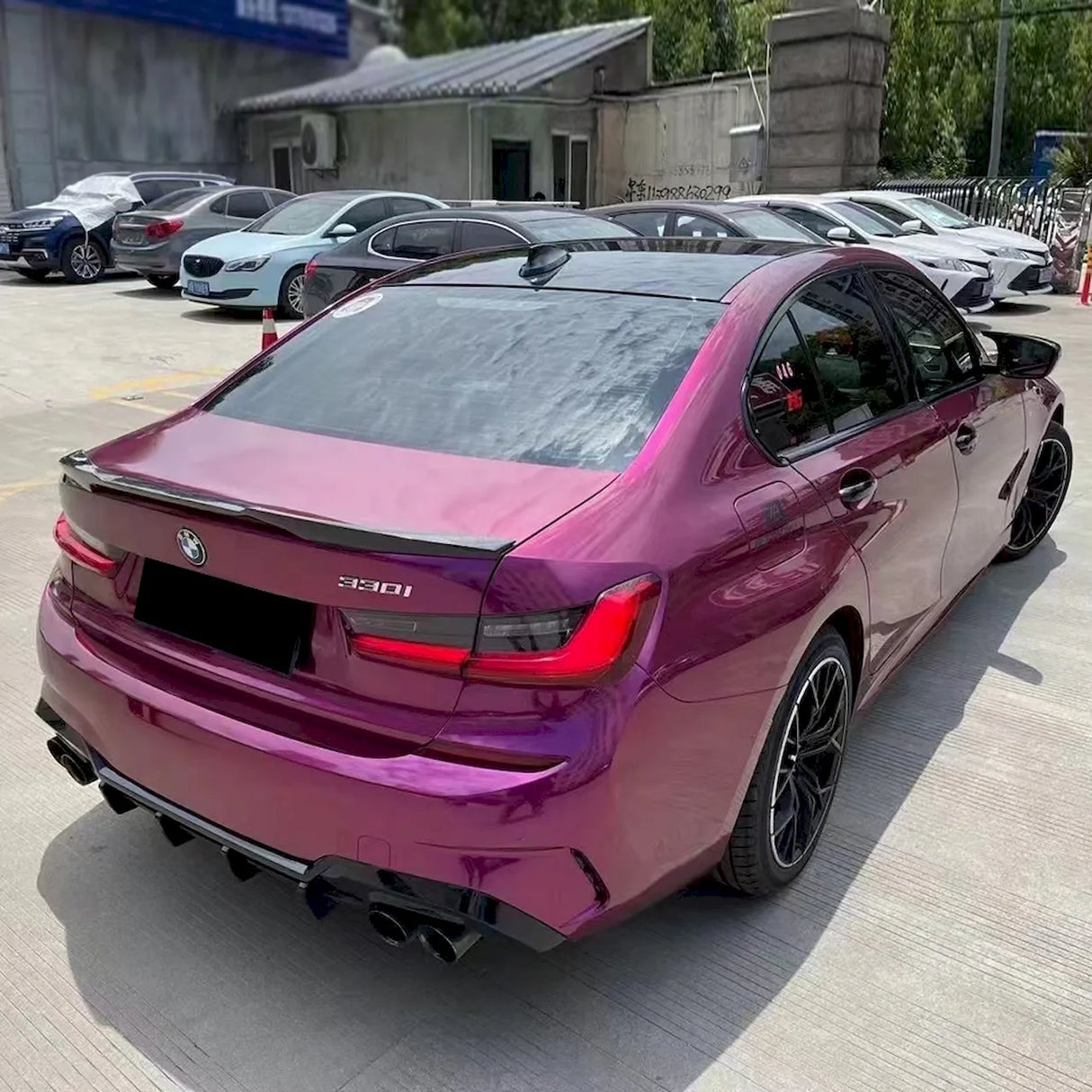 pearl purple gloss car wrap installed on a sedan