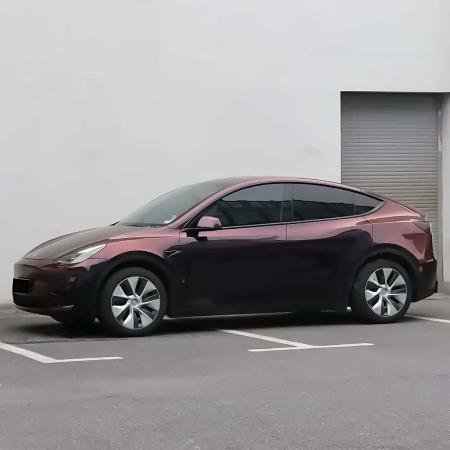 phantom red car wrap on a tesla side shot