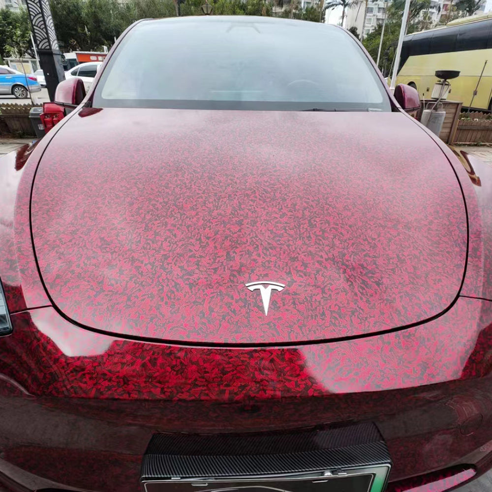 close up shot of red forged carbon car wrap