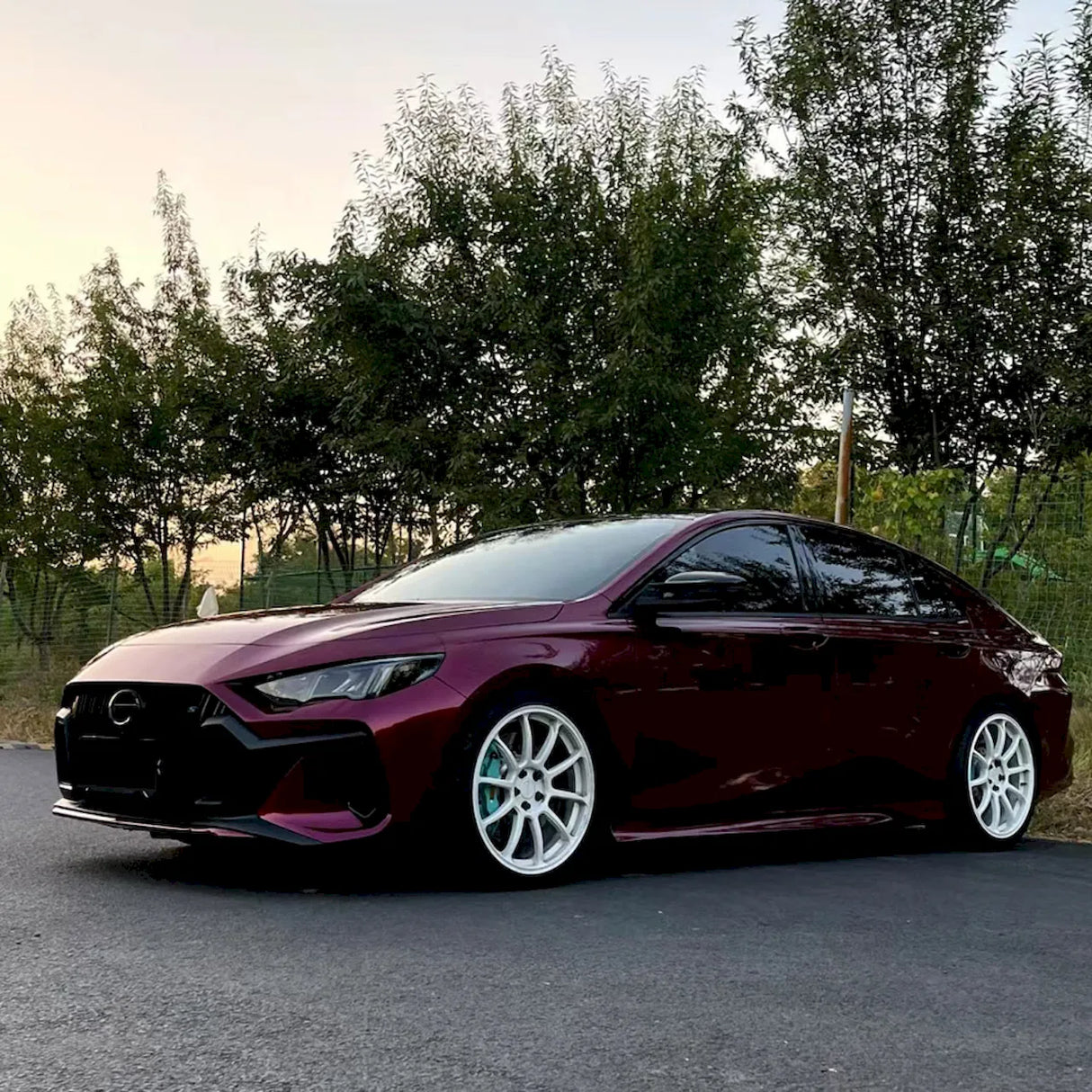 rupee purple car wrap installed on a sports car