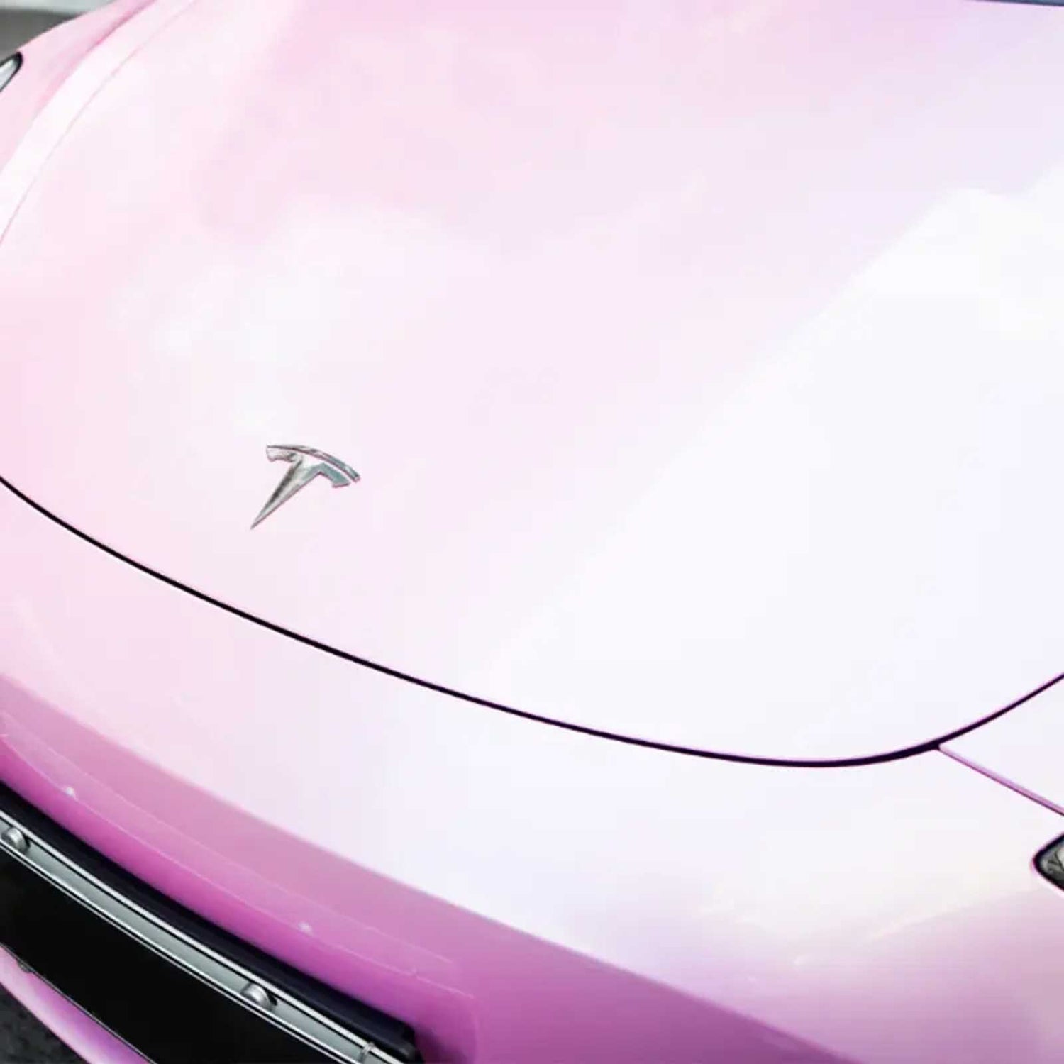 light pink car wrap on a tesla