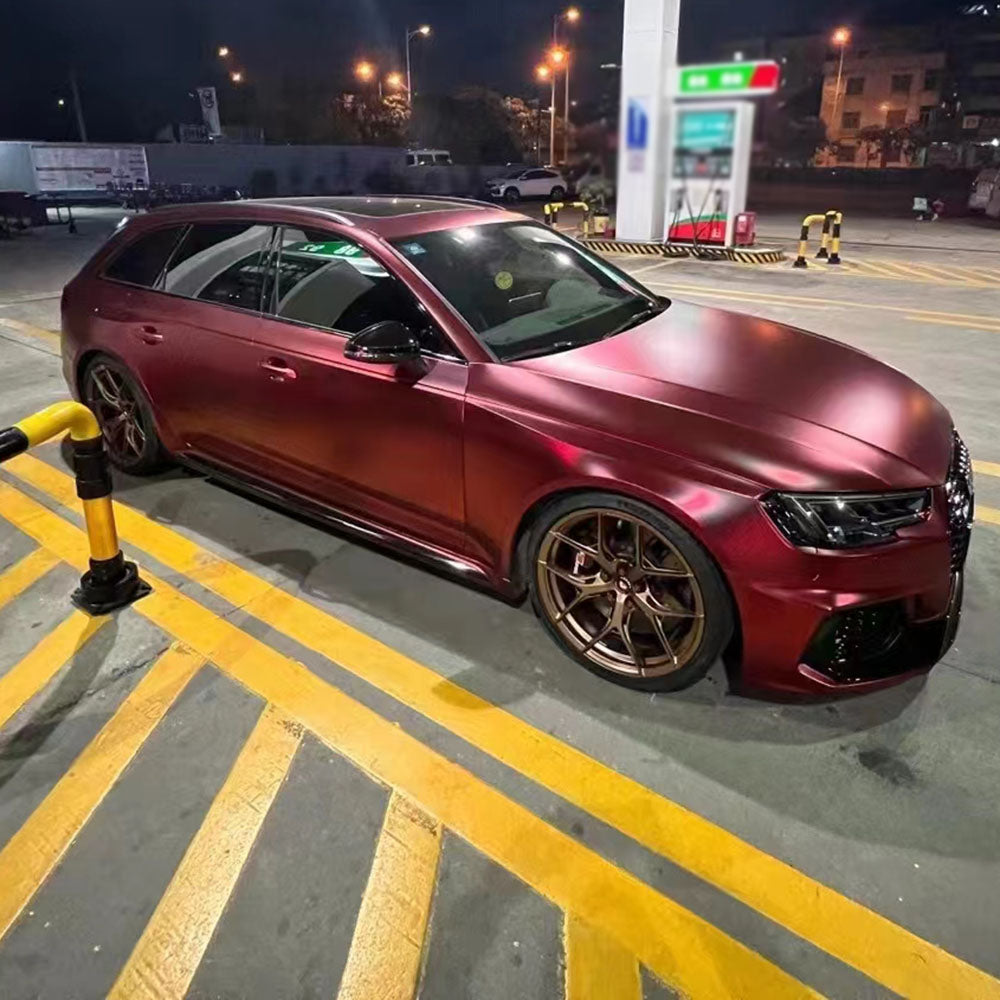 satin romance red car wrap under gas station lighting