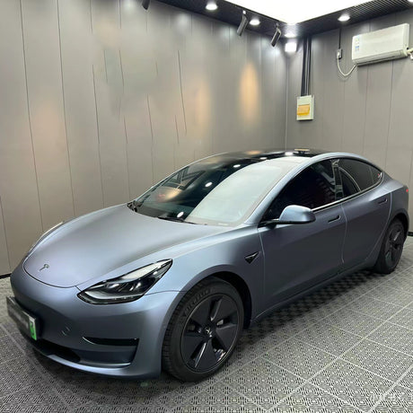 ultra matte blue gray car wrap being installed