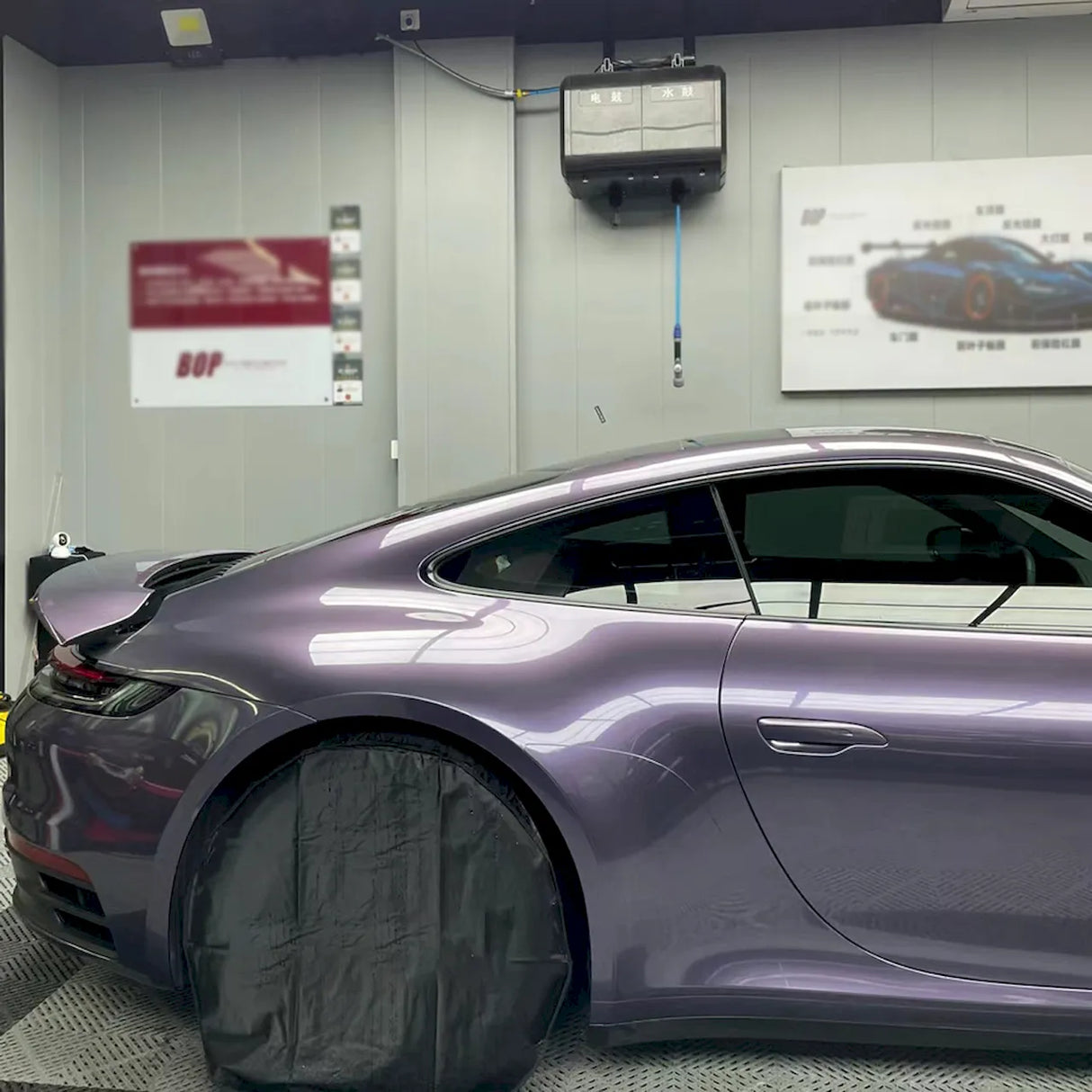 violet gray purple gloss car wrap being installed on a vehicle