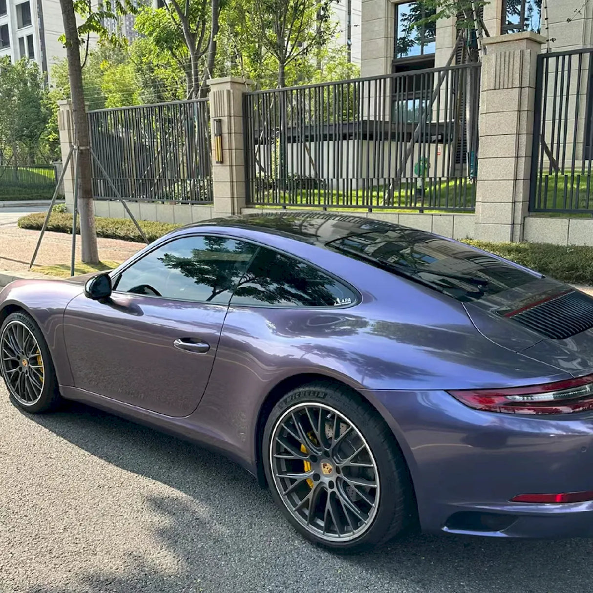 car wrapped in a violet gray purple gloss vinyl wrap