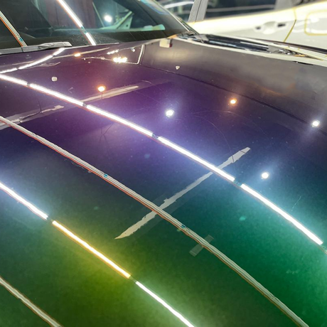 close up shot of demon green sparkling chameleon car wrap