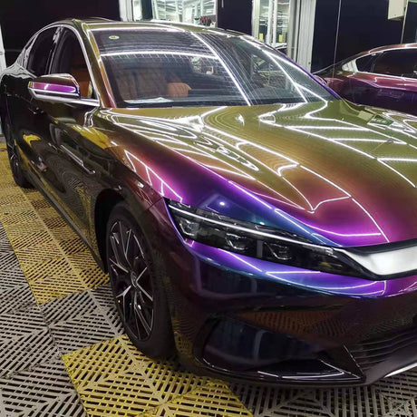 fancy galactic sparkling chameleon purple to gold color changing car wrap on a car