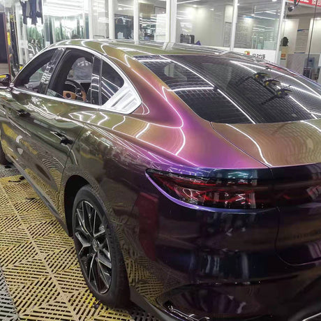 a car wrapped in fancy galactic sparkling chameleon purple to gold color changing car wrap