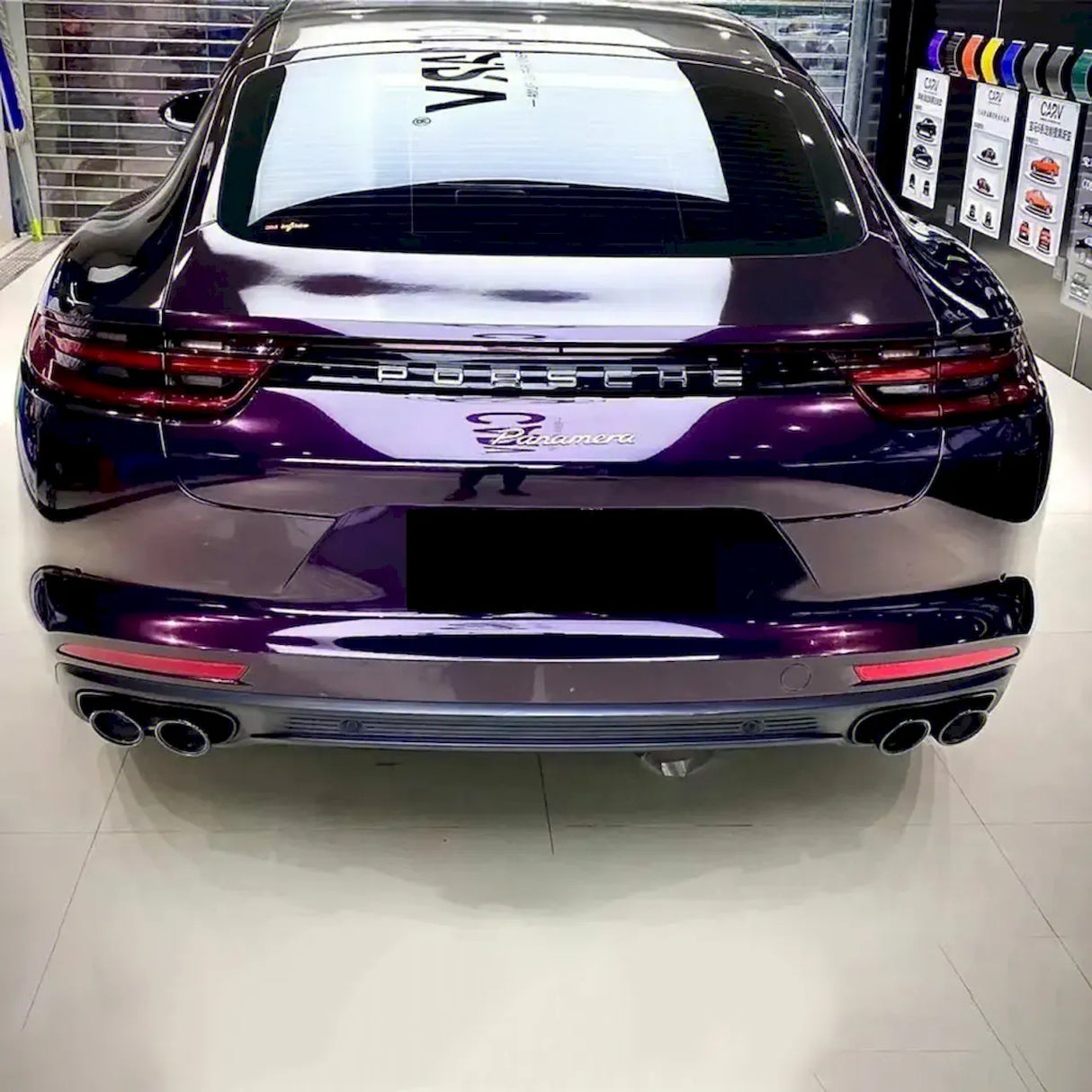 amethyst purple car wrap being installed on a vehicle