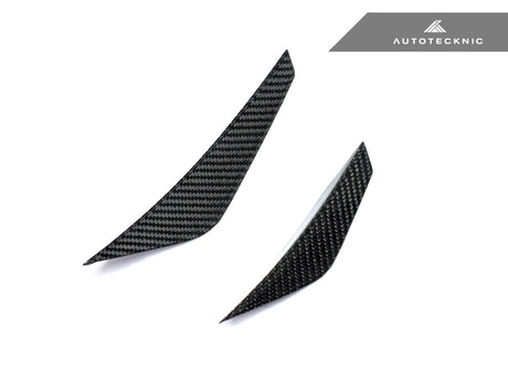 close up shot of dry carbon fiber canard set by autotecknic for g8x bmw