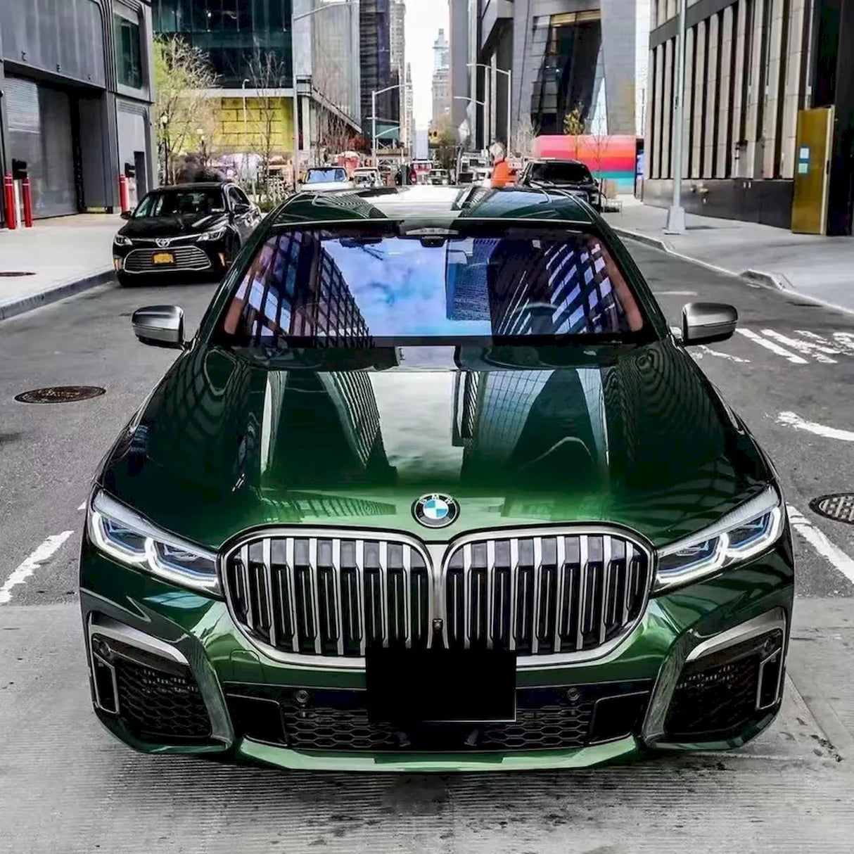 blackish green car wrap installed on a large vehicle