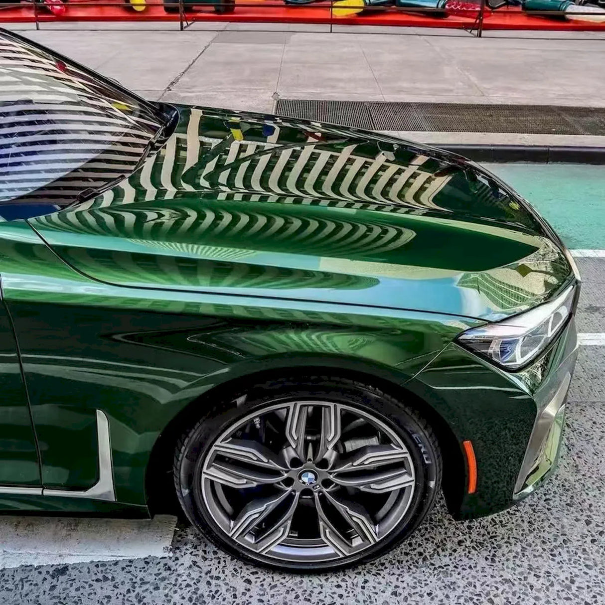 blackish green gloss car wrap installed on a vehicle