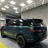 blackish green car vinyl wrap being installed
