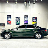 car wrapped in blackish green car vinyl wrap
