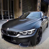 bmw wrapped in ceramic black car wrap