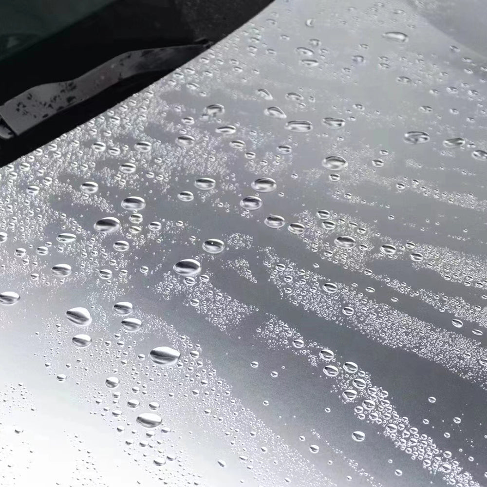 chrome alexander silver car wrap with water drops on the wrap