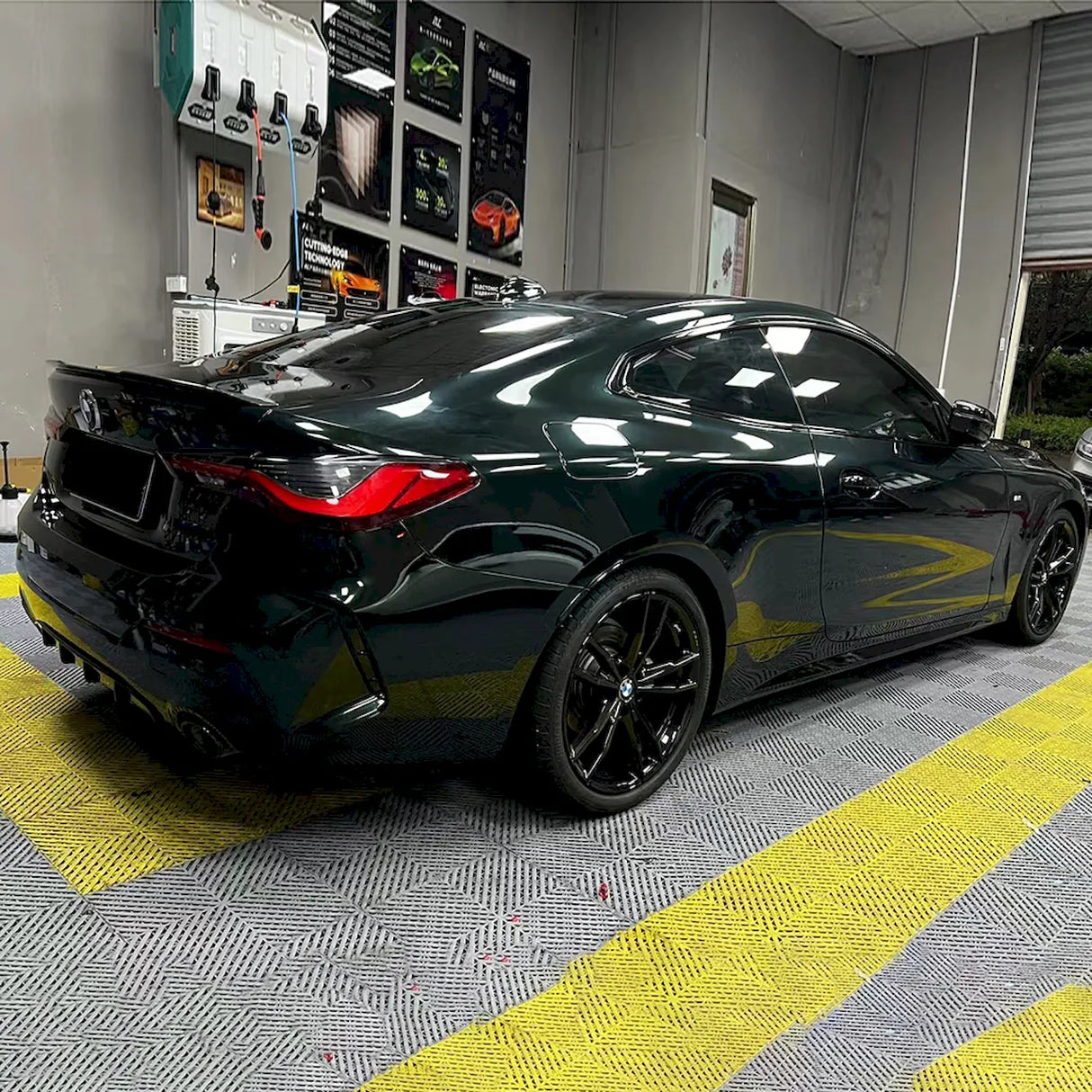 car being wrapped in emerald green car wrap