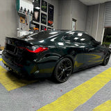 car being wrapped in emerald green car wrap