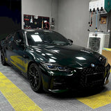 installation of dark emerald green car vinyl wrap
