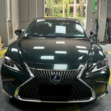 dark emerald green vinyl wrap being installed