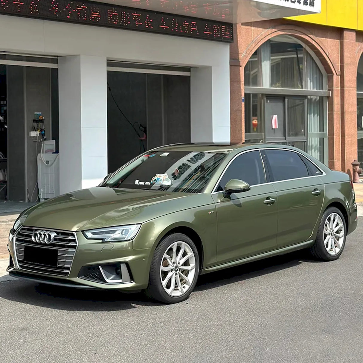 car wrapped in gloss night green vinyl wrap