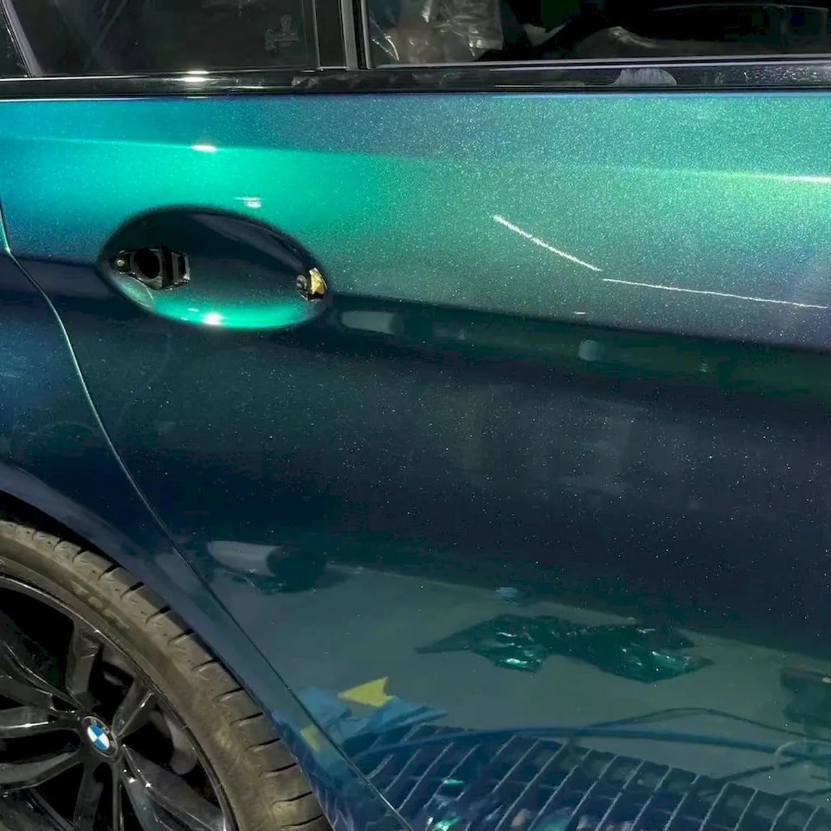 installation of diamond aurora green blue vinyl wrap for cars
